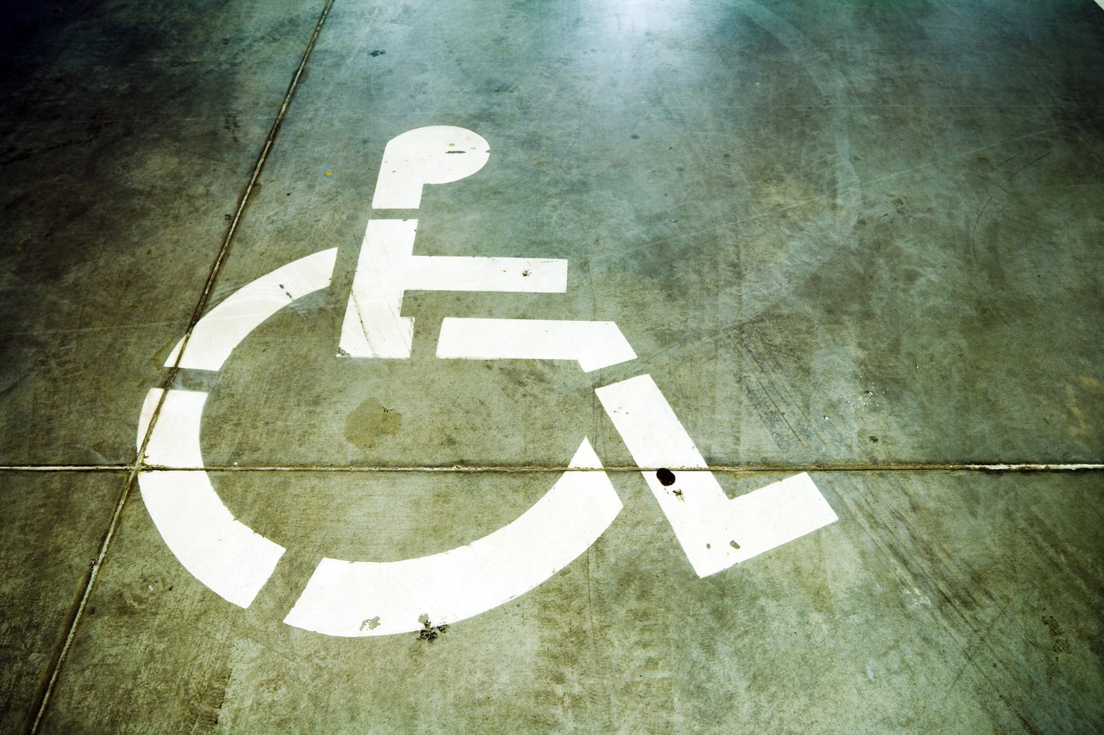 Disability sign on grunge garage floor